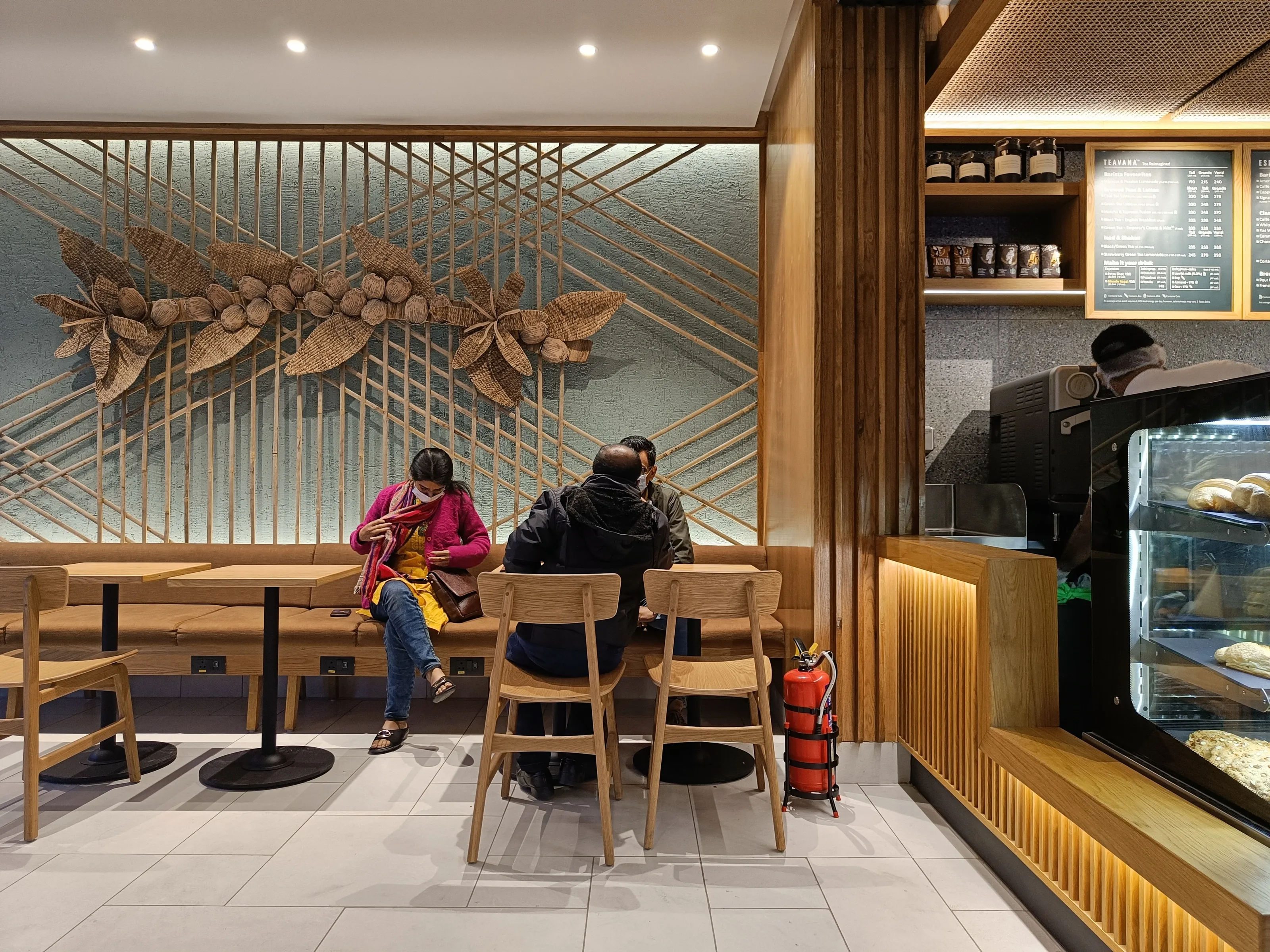 Woven cane and water hyacinth coffee-flower installation at Starbucks GS Road, Guwahati